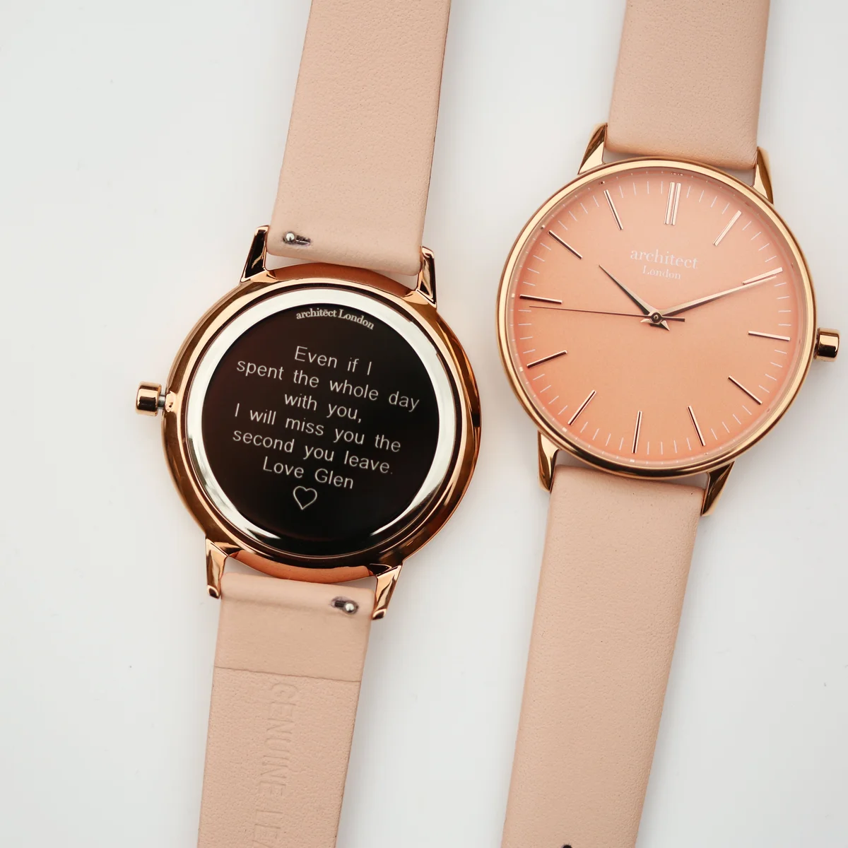 Ladies coral watch with apricot coral dial, polished stainless steel case, and light pink genuine leather strap on white background