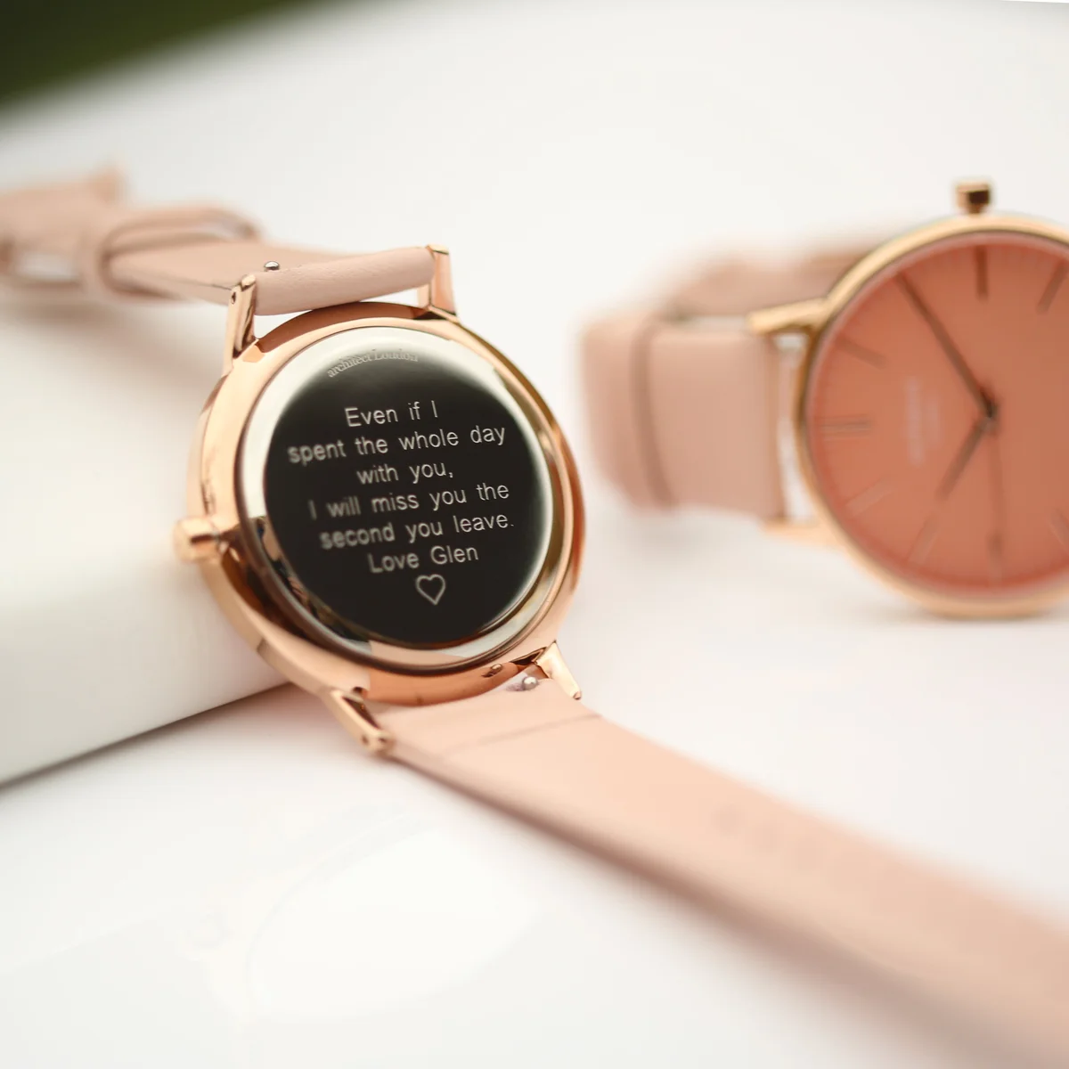 Ladies Architēct Coral watch with apricot coral dial and light pink leather strap on a white background