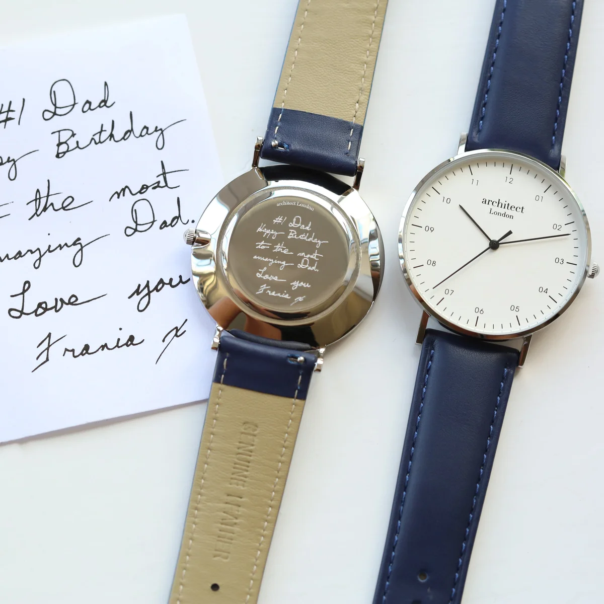 Men's minimalist watch with polished stainless steel case and admiral blue genuine leather strap on white background
