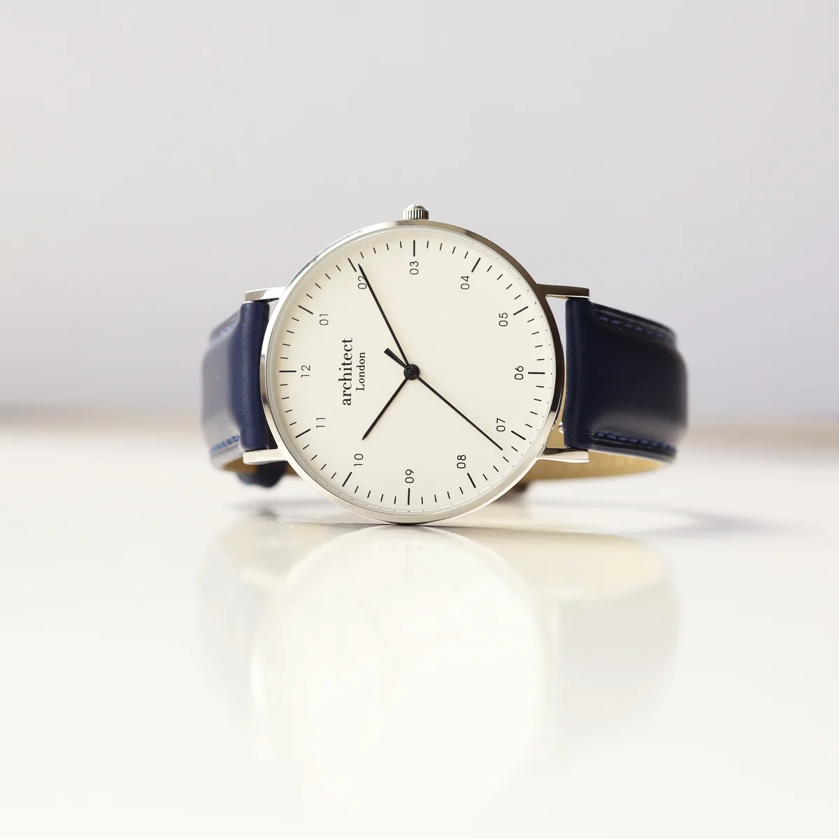 Men’s Architect Zephyr leather strap watch with polished stainless steel case and Admiral blue genuine leather strap displayed flat
