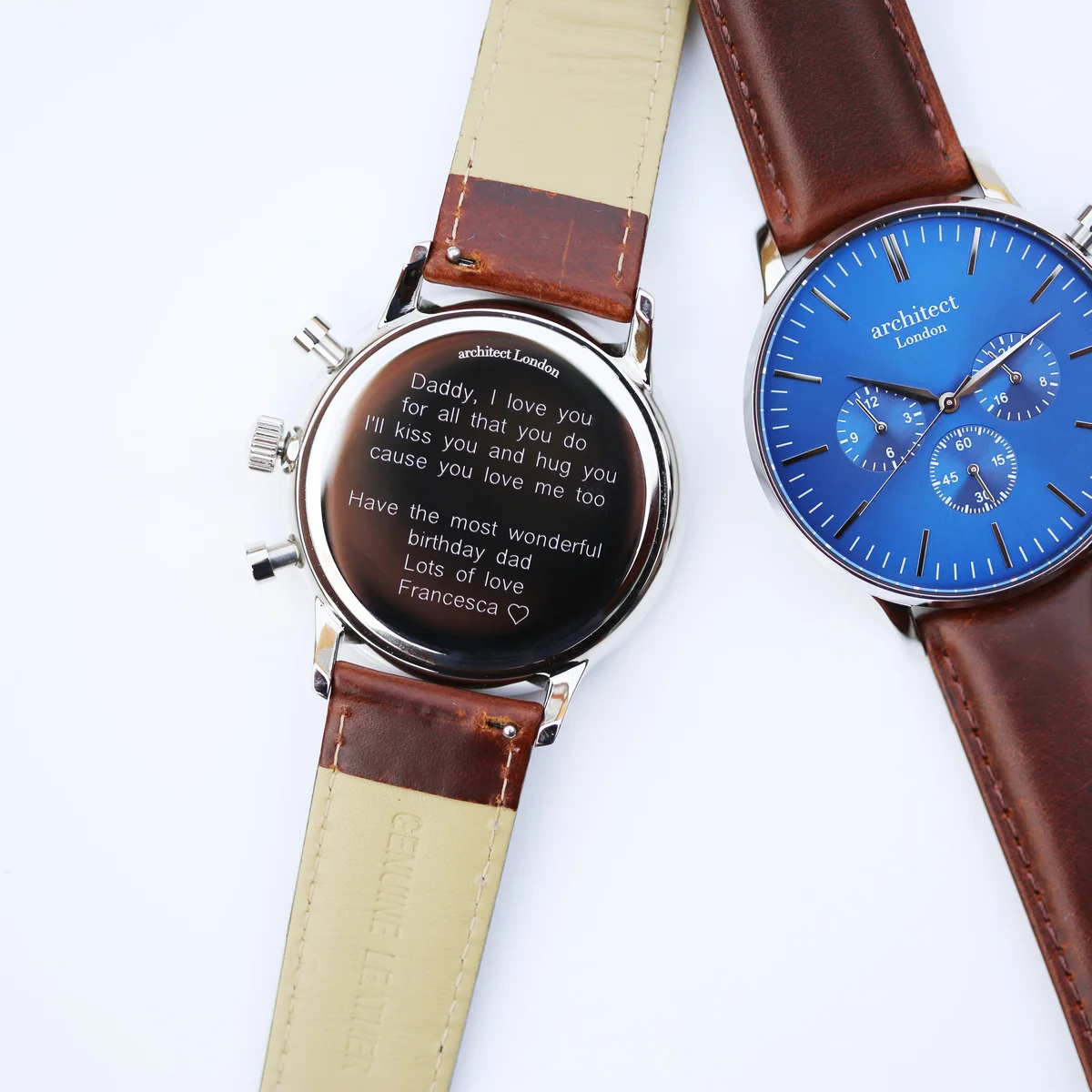 Men's leather strap watch with deep-space blue dial, walnut brown strap, three chronograph subdials, and polished steel case