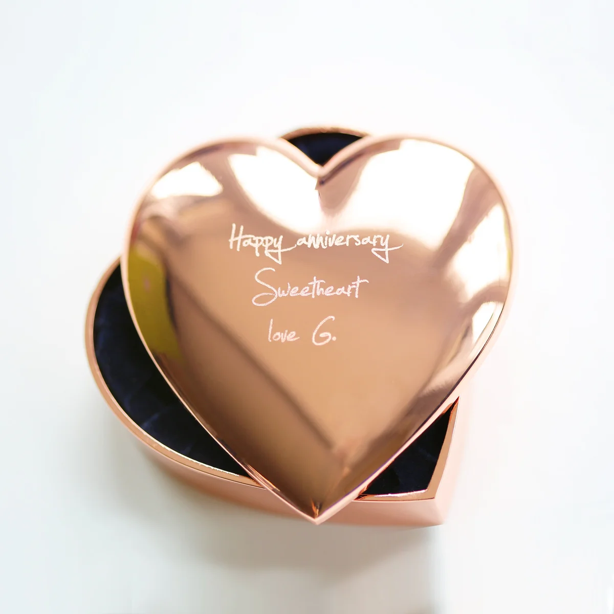 Rose gold heart-shaped personalised trinket box with polished finish and engraved handwriting on the lid