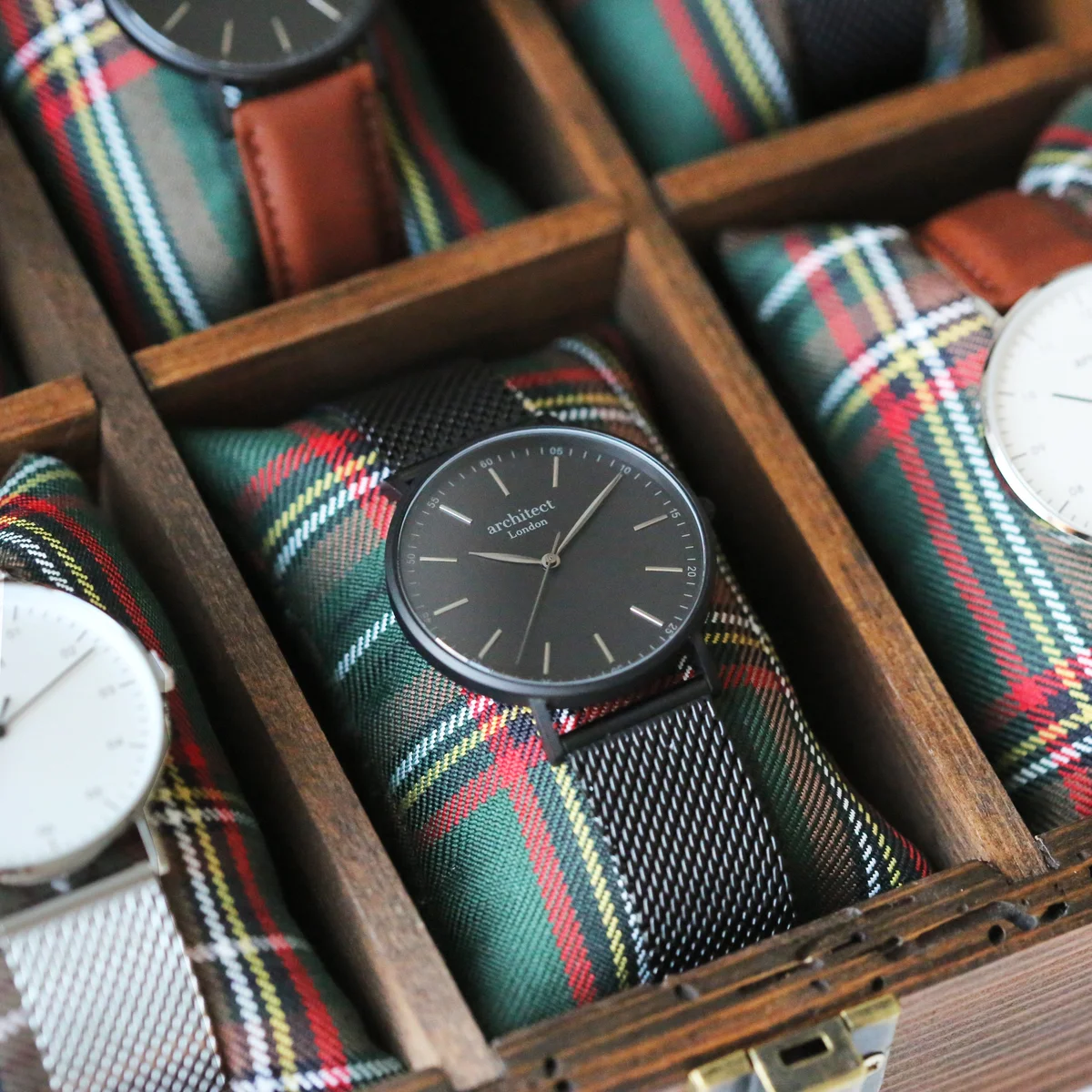 Personalised men's watch with pitch black mesh strap, brushed stainless steel case, and minimalist dial on white background