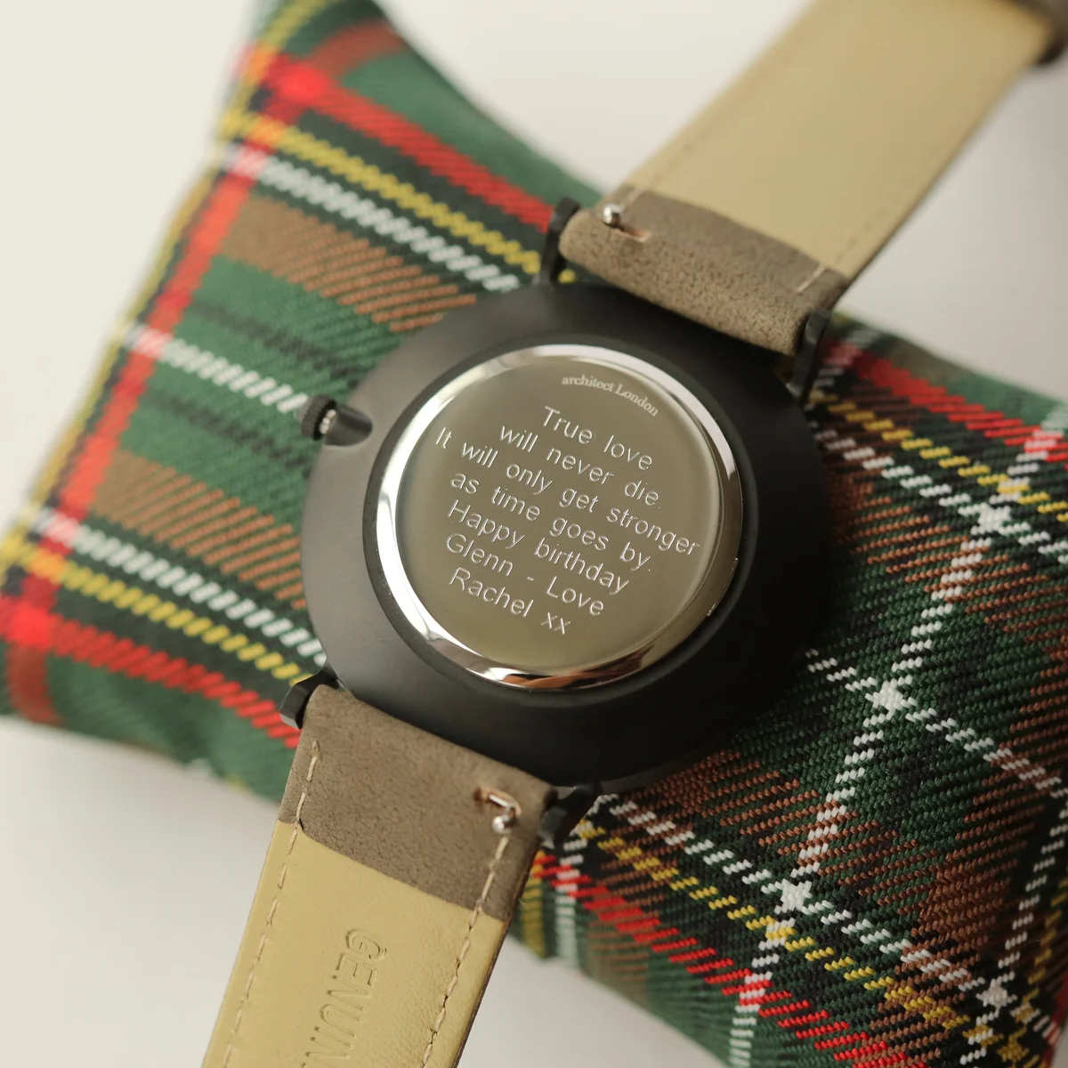 Men’s minimalist watch with sandblasted gunmetal case and urban grey genuine leather strap on white background