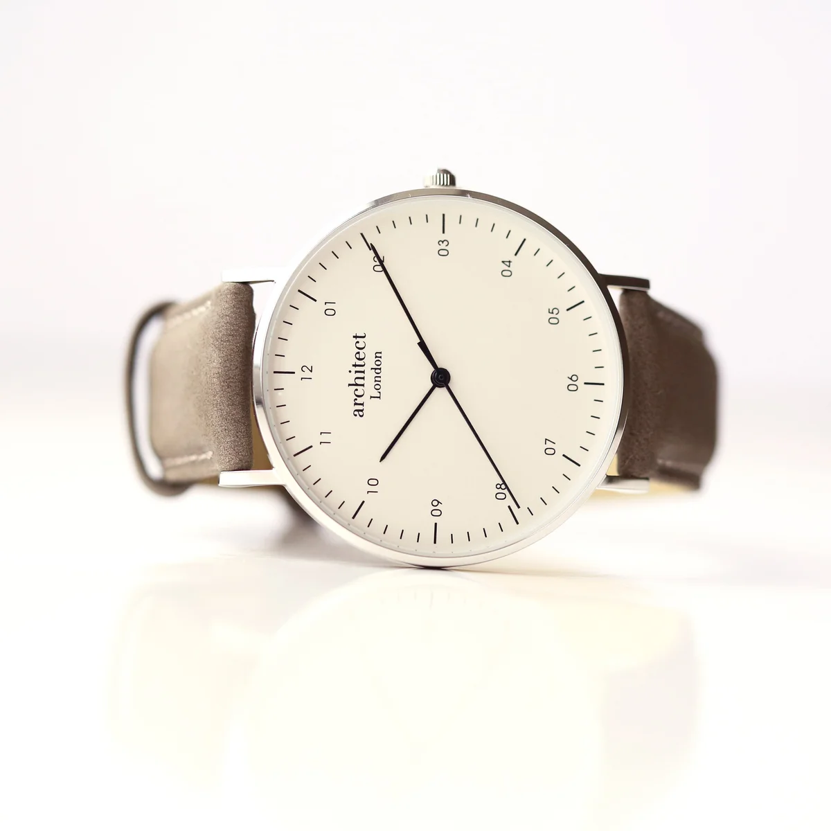 Personalised men's watch with minimalist stainless steel case, urban grey leather strap, and modern font engraving option