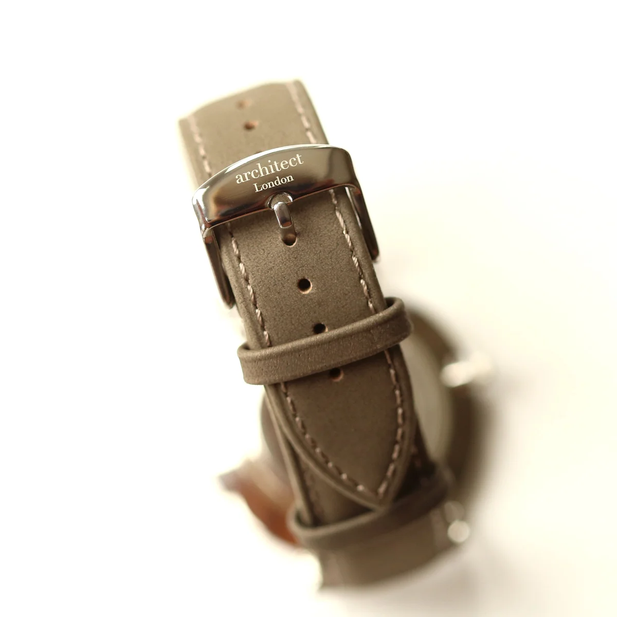 Engraved men's watch with polished stainless steel case, minimalist dial, and urban grey genuine leather strap on white background