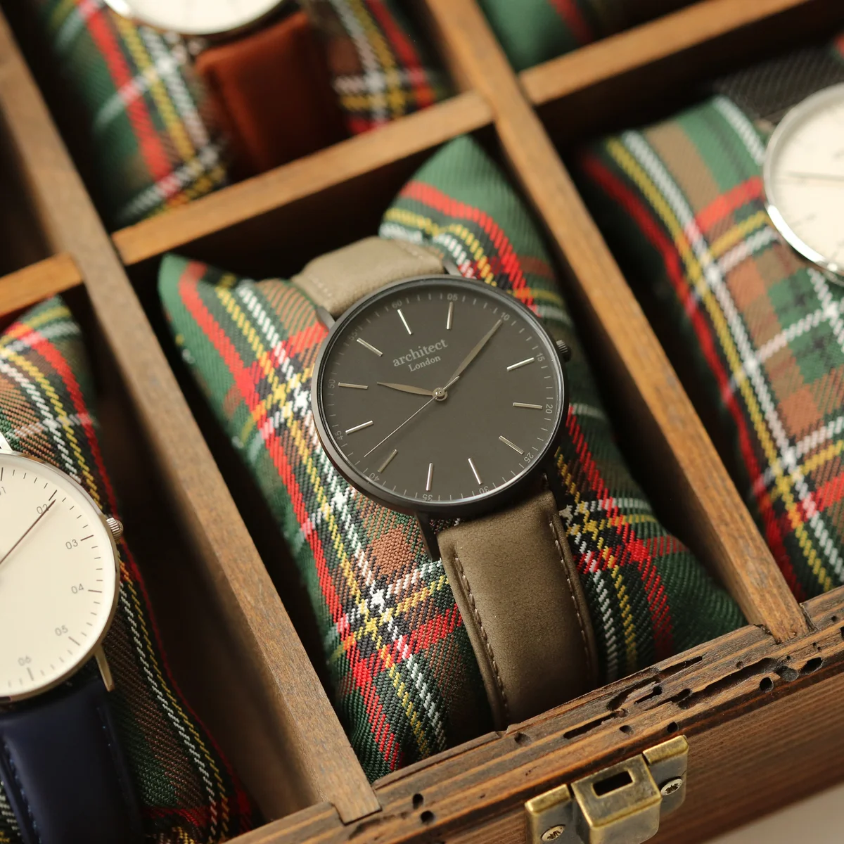 Minimalist men's watch with urban grey genuine leather strap and brushed stainless steel case on white background