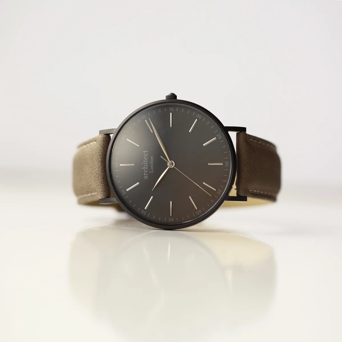Men's minimalist watch with urban grey genuine leather strap and engraved leather watch back detail