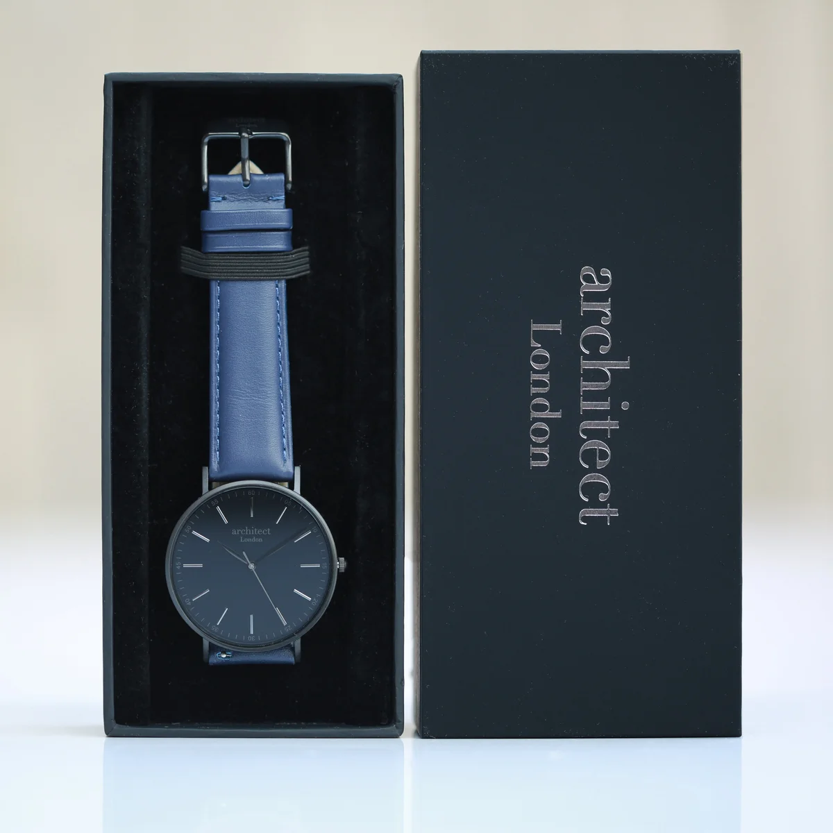 Men’s minimalist stainless steel watch with admiral blue genuine leather strap on white background