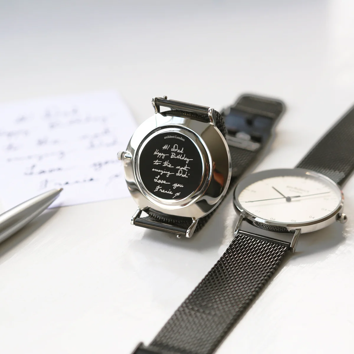Men’s Architect Zephyr quartz movement watch with pitch black mesh strap and polished stainless steel case on white background