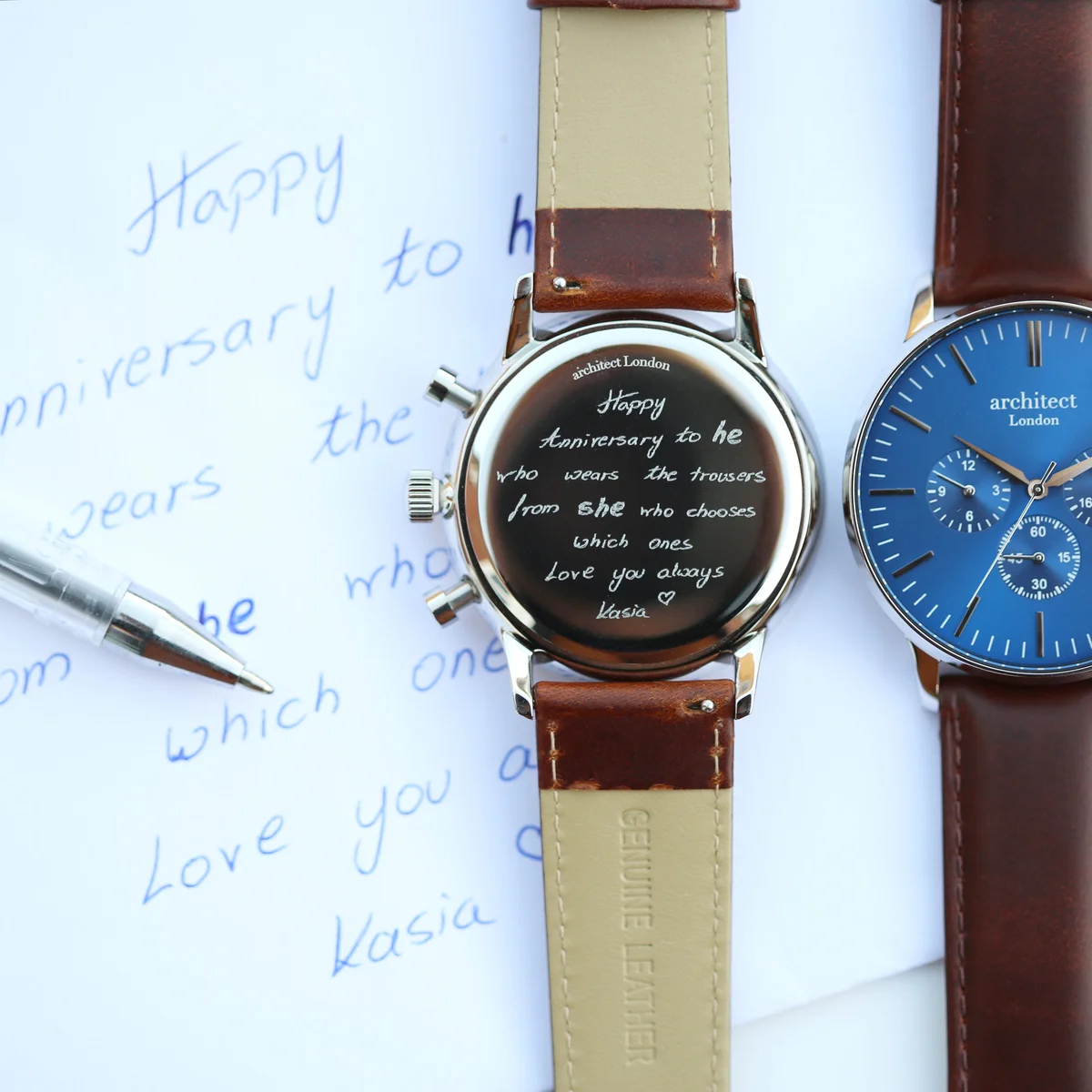 Deep-space blue Architect Motivator Watch with walnut brown leather strap and three chronograph subdials on white background