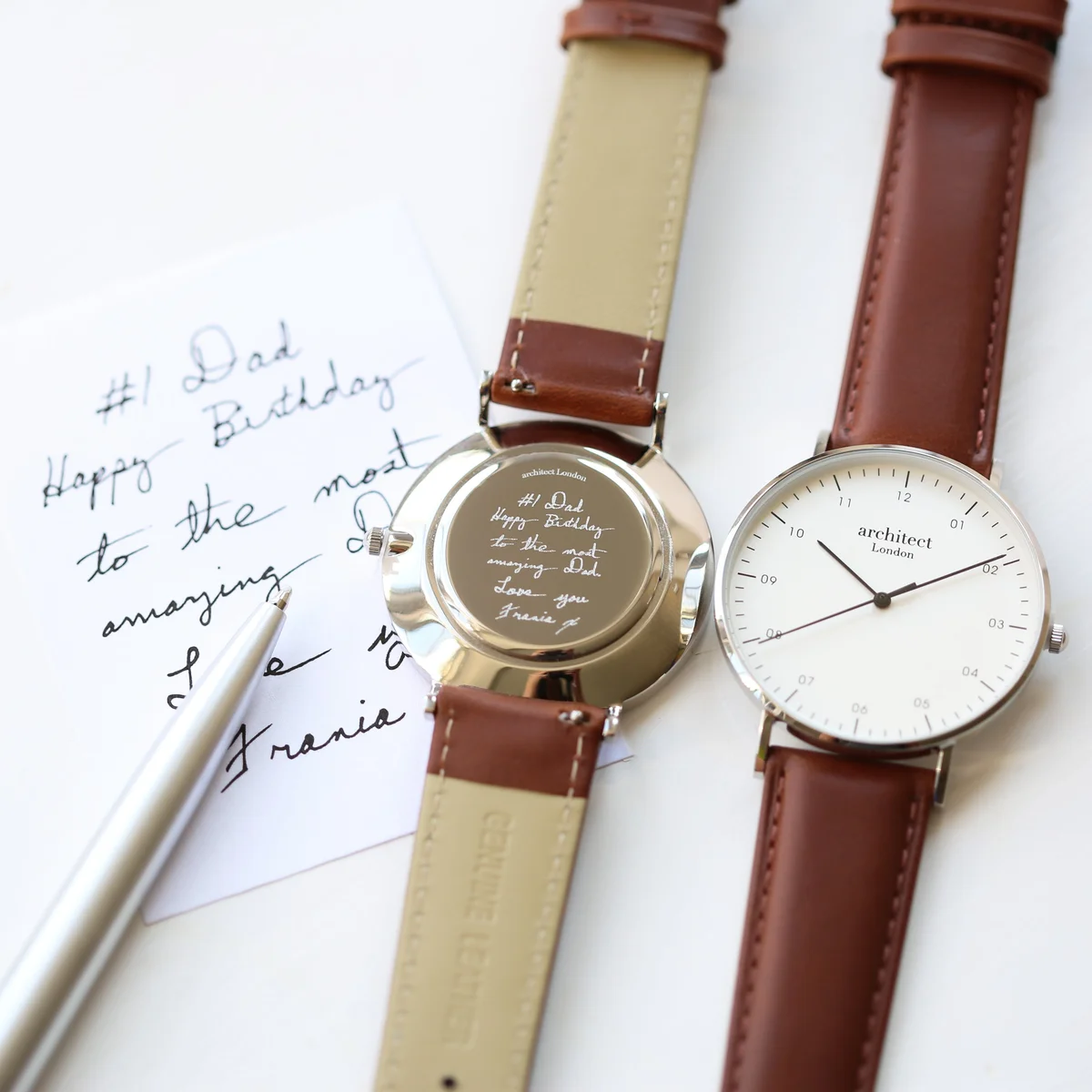 Personalised men's watch with minimalist stainless steel case, walnut strap, and custom handwriting engraving on back