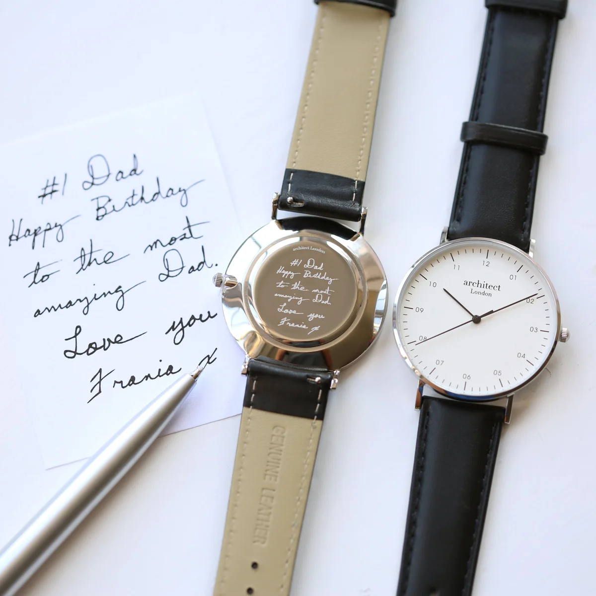 Personalised men's watch with polished stainless steel case, black leather strap, and minimalist dial design
