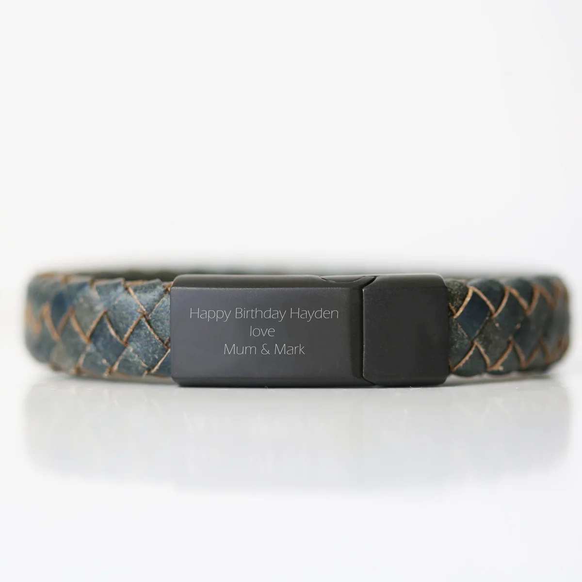 Personalised leather bracelet in antique style with woven genuine leather strands and iron snap-lock clasp on white background