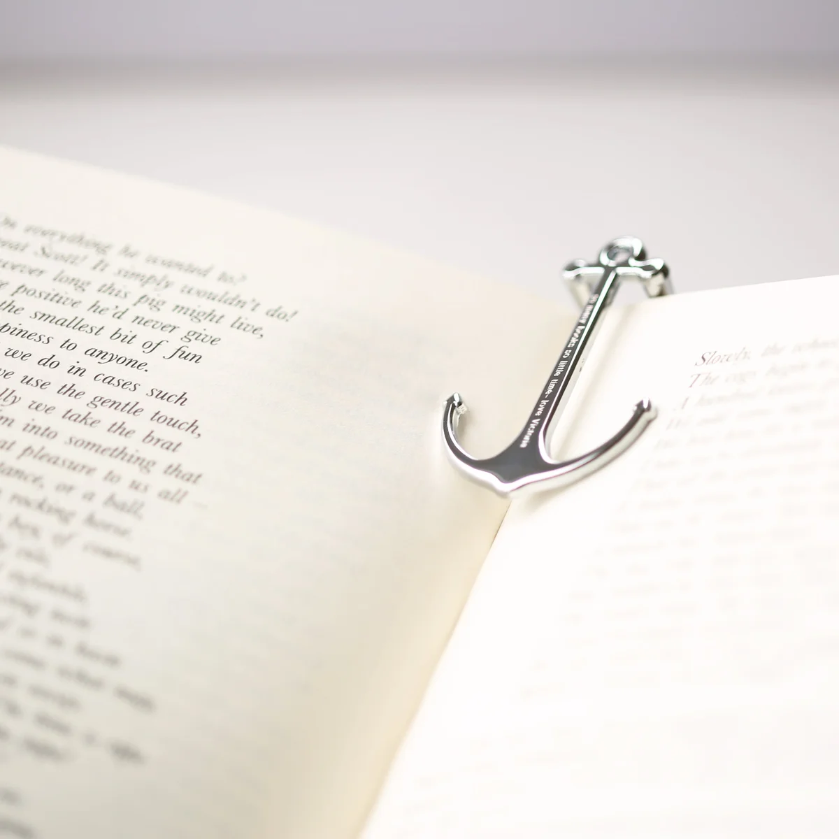 Silver and black engraved book holder made of polished metal with modern font engraving and gift box included