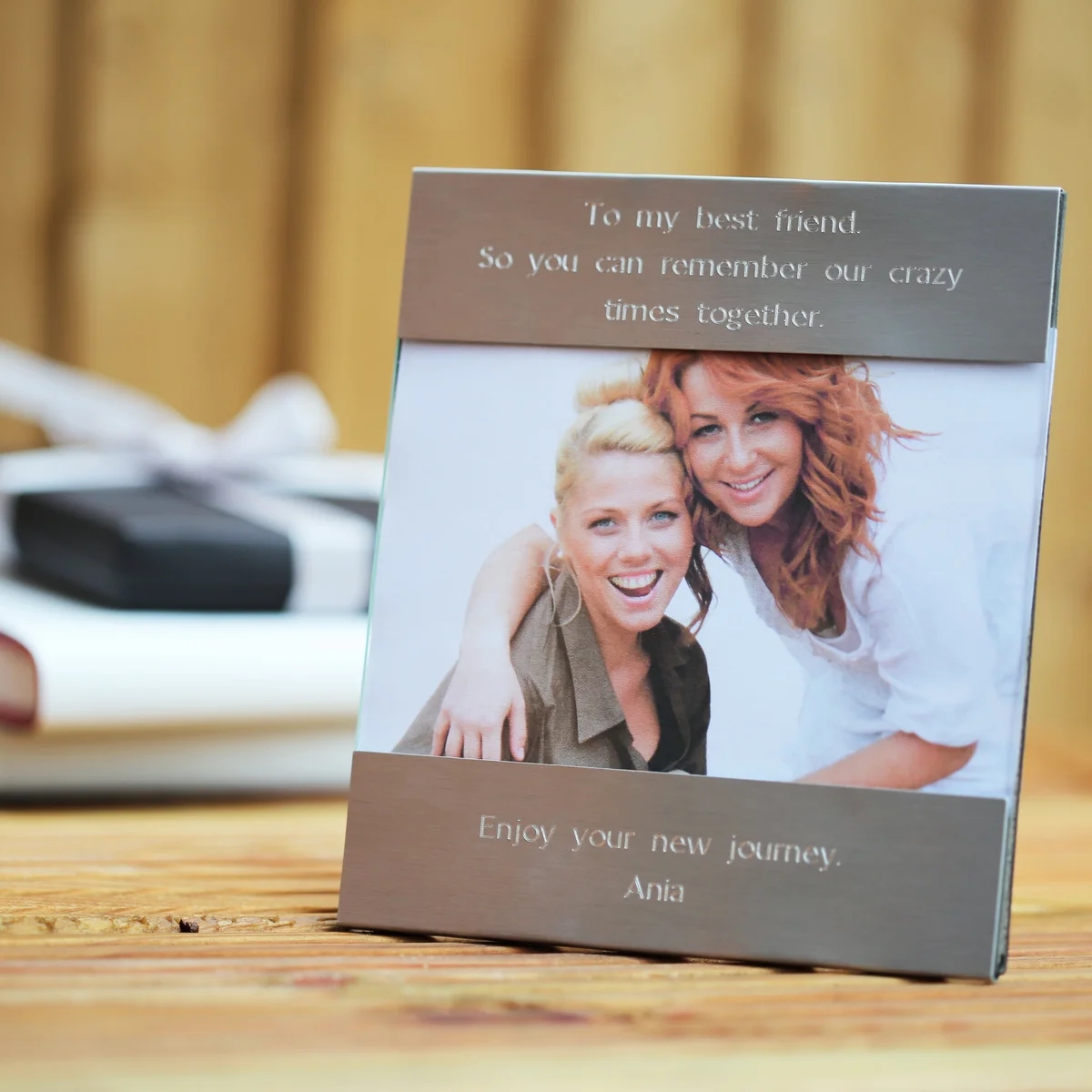 Modern engraved photo frame in polished stainless steel with personalised engraving on top and bottom halves