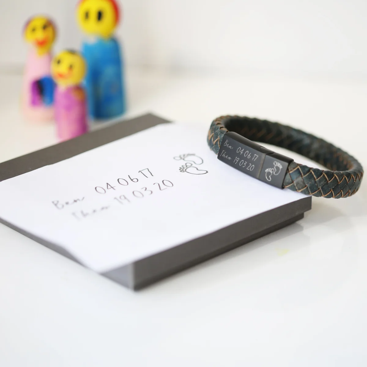 Iron-coloured antique style bracelet with engraved handwriting on genuine leather strands and magnetic snap clasp