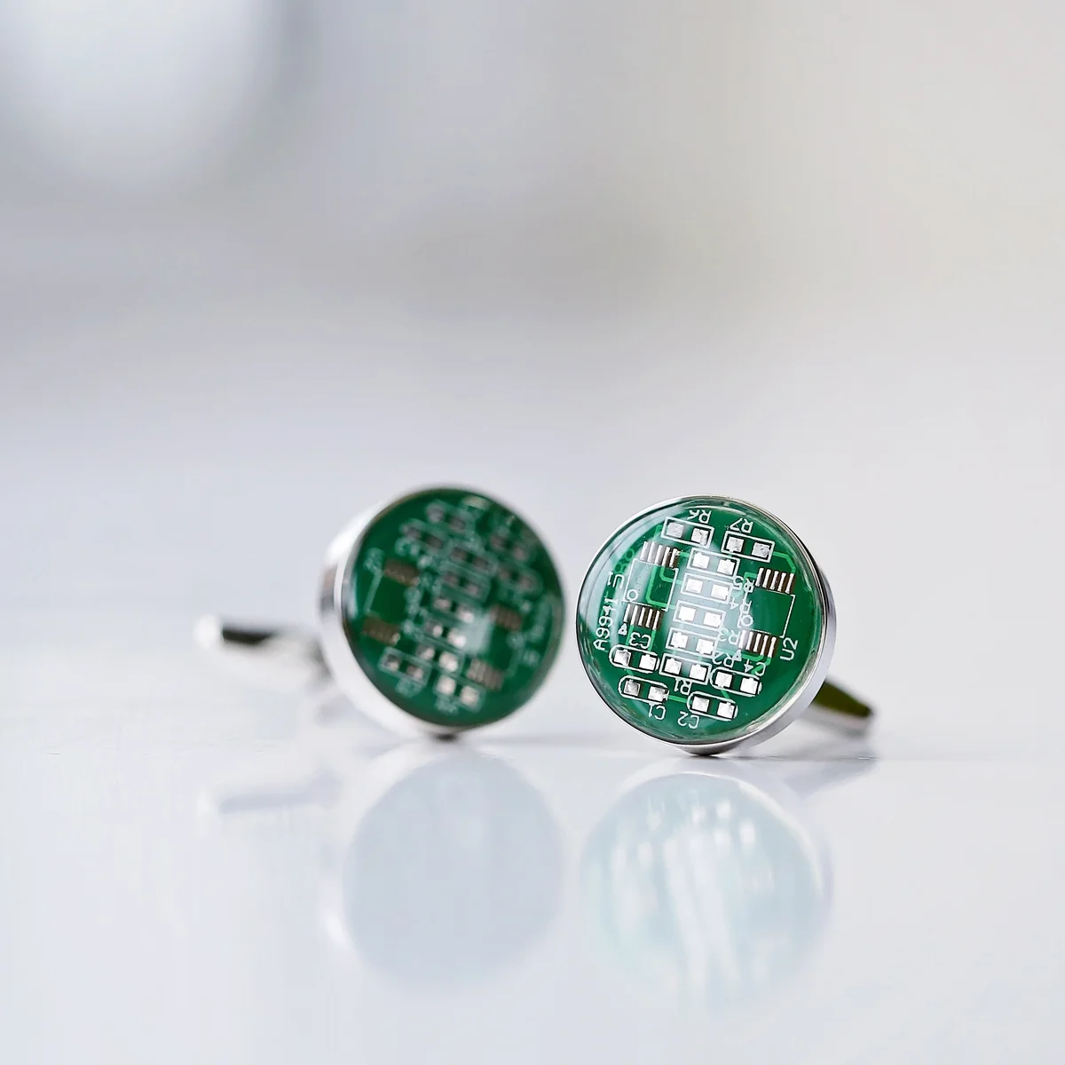 Pair of real circuit board cufflinks displayed with a personalised cufflinks gift engraved box on a white background