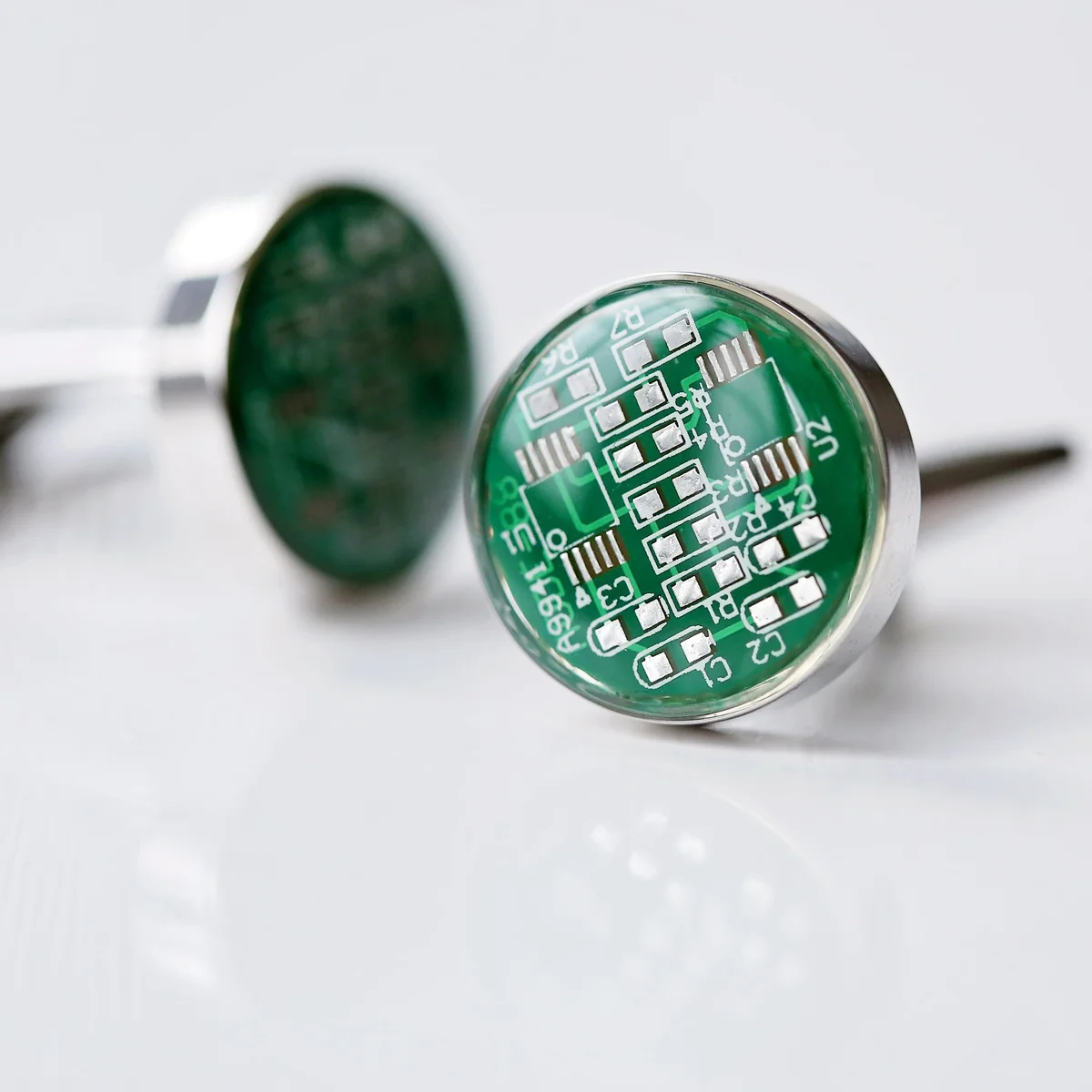 Real circuit board cufflinks displayed next to a personalised engraved cufflink box with custom message engraving