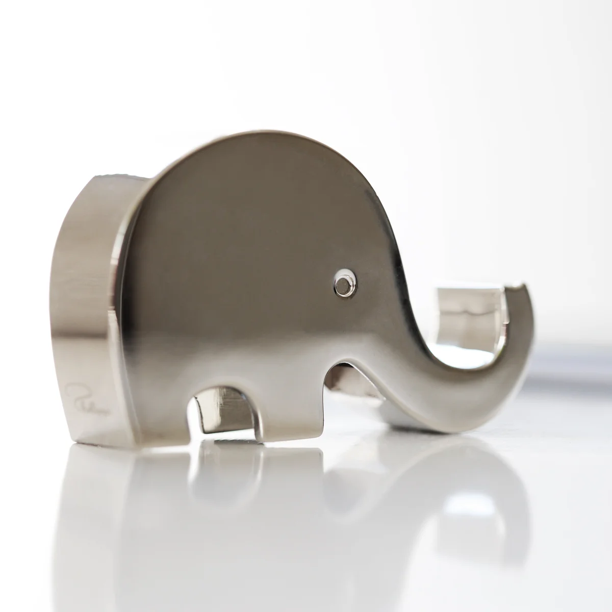 Polished stainless steel elephant phone holder engraved with custom message, a unique phone stand gift for special occasions