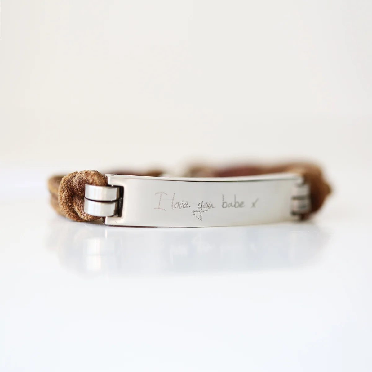 Men’s personalised leather bracelet in tan with engraved handwriting on wide leather strap and snap-lock clasp