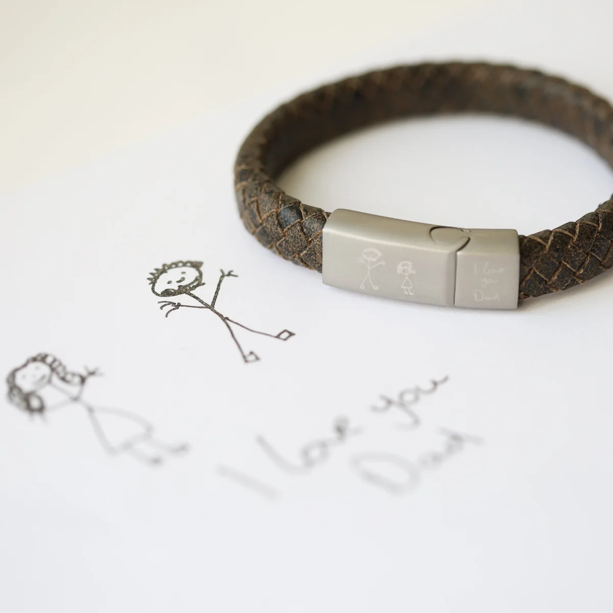 Rustic personalised leather bracelet with engraved handwriting on woven genuine leather strands and magnetic snap clasp