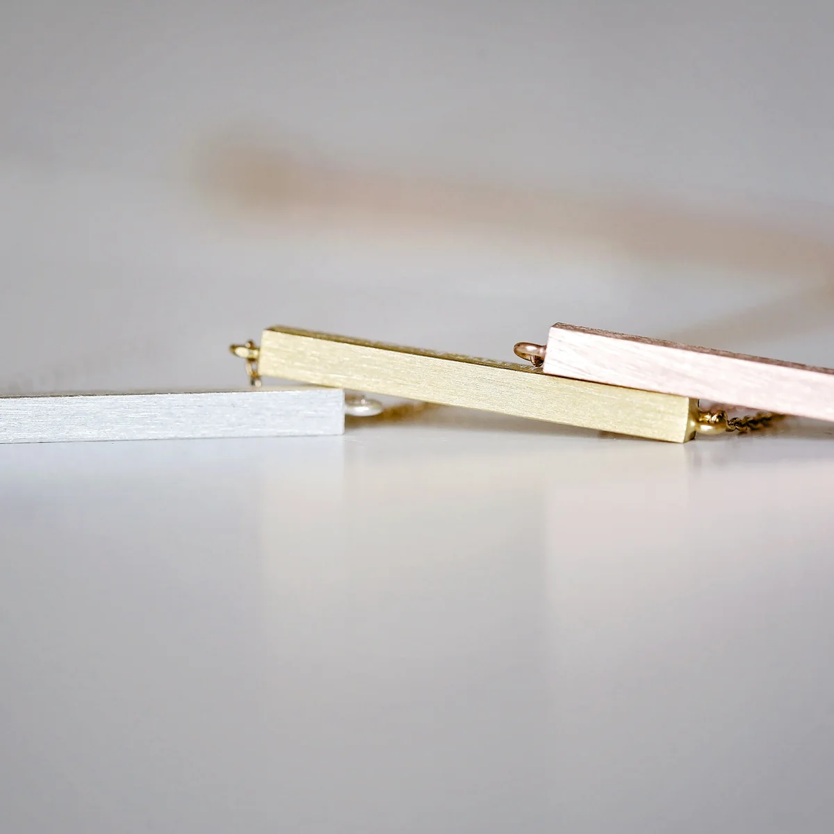 Rose gold necklace with a modern engraved horizontal bar on a 49cm adjustable chain in a gift box