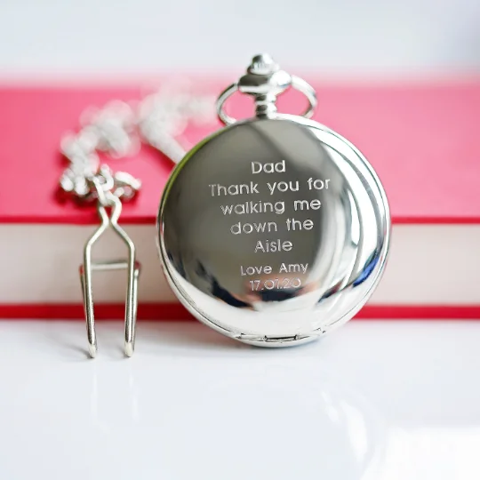 Open dual pocket watch showing skeleton mechanical wind-up watch movement with engraved modern font on case