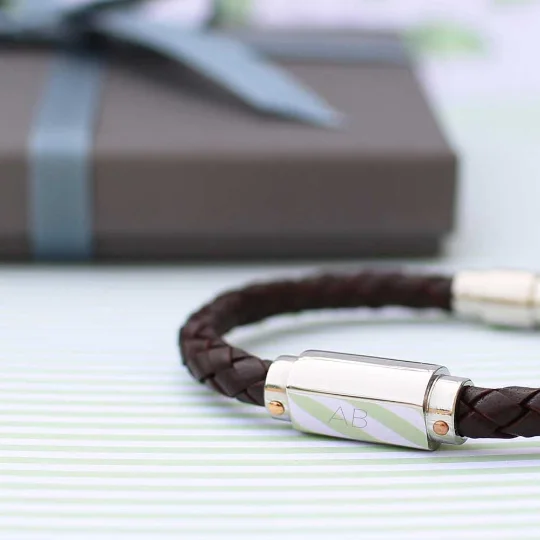 Personalised leather bracelet made of twisted genuine leather with a stainless steel magnetic snap-lock clasp on white background