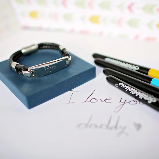 Men's woven leather bracelet with magnetic snap lock clasp, engraved with custom handwriting on stainless steel plate