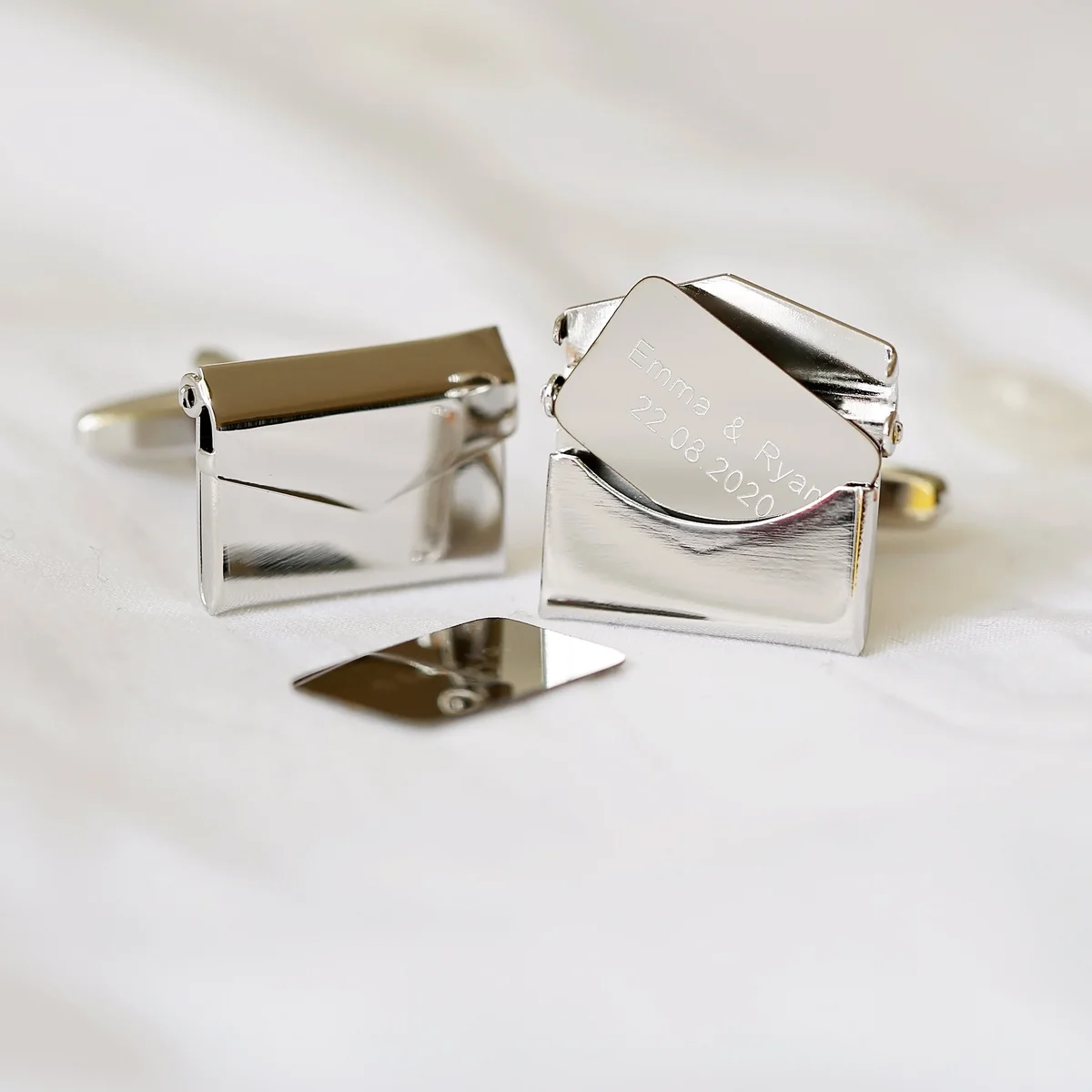 Polished stainless steel engraved cufflinks with secret message, displayed with eco-friendly presentation box