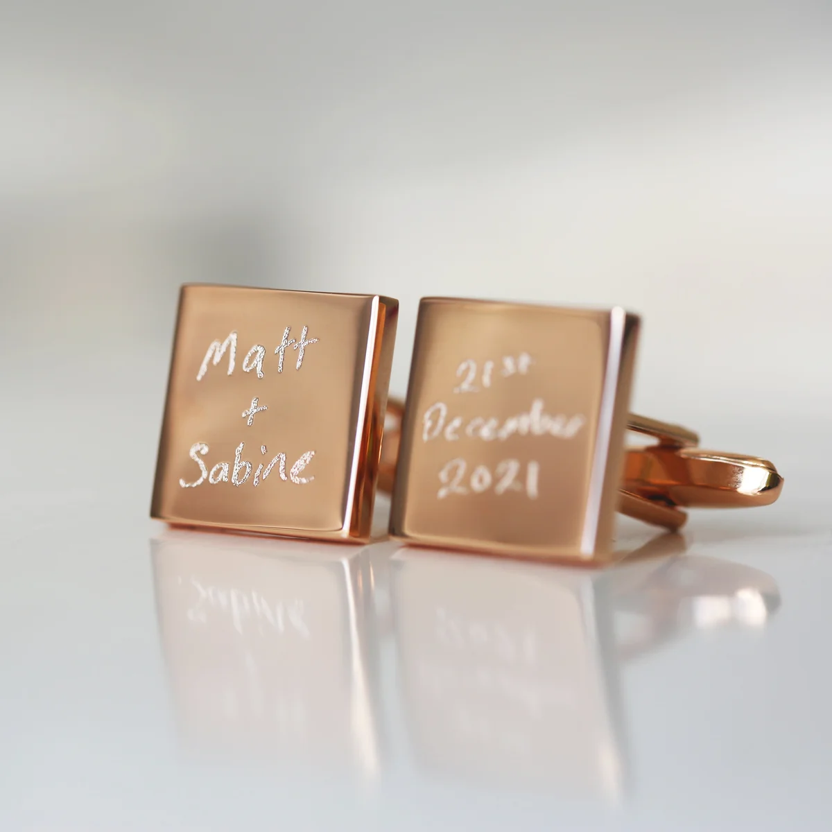 Engraved men cufflinks showing personalised handwriting on polished stainless steel square faces in silver finish