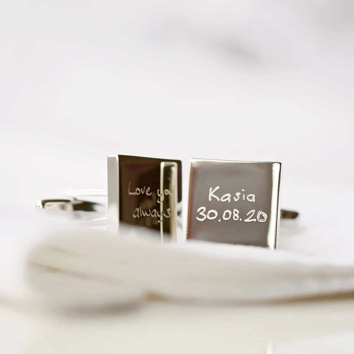 Pair of polished stainless steel custom handwriting cufflinks engraved with a handwritten message, shown in eco-friendly box