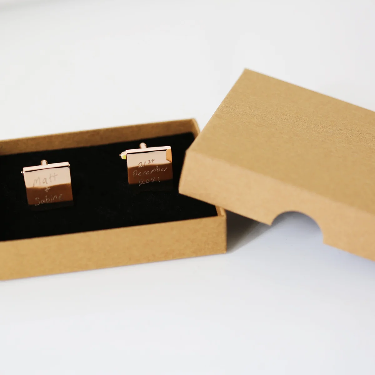 Pair of polished stainless steel personalised handwriting cufflinks engraved with a child's drawing on square faces
