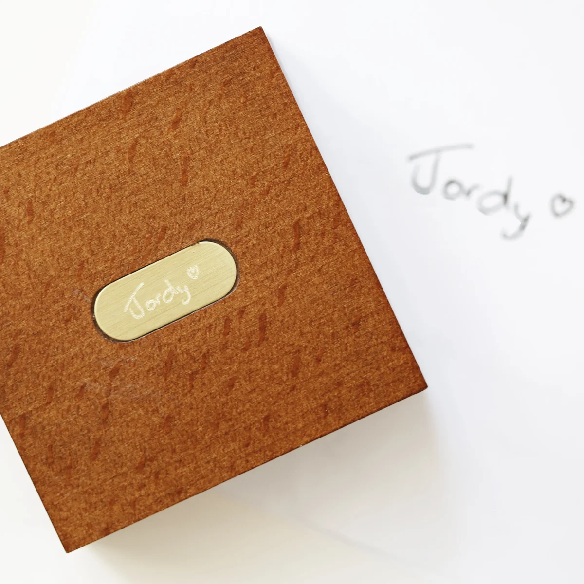 Personalised brass compass inside an open mahogany timber box with monogrammed brass plate and ribbon gift box