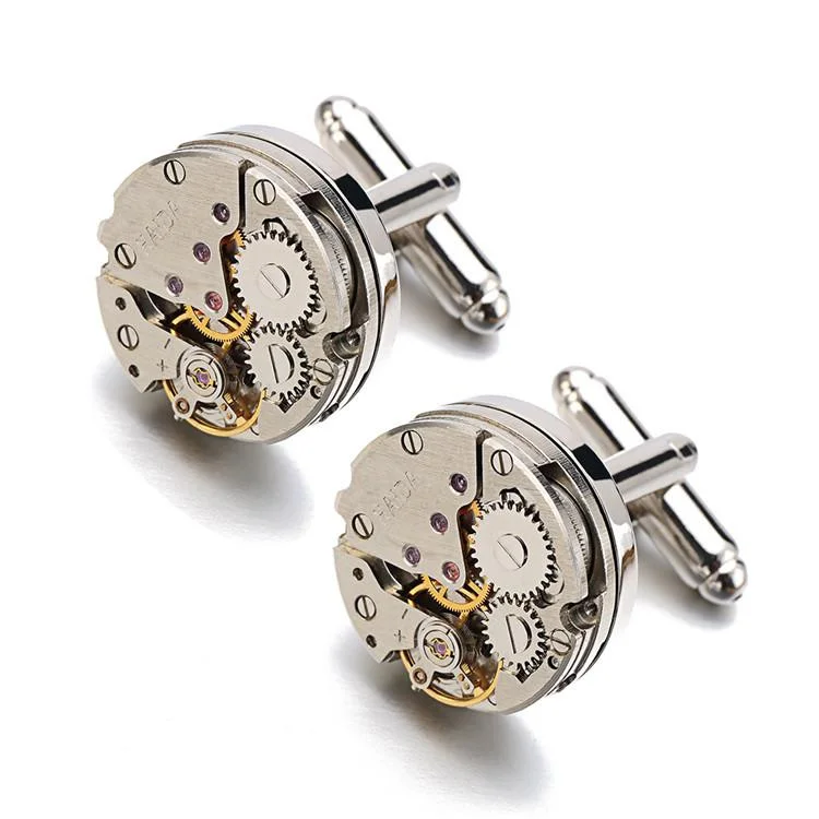 Engraved cufflink box open displaying personalised gear movement cufflinks with visible stainless steel moving parts