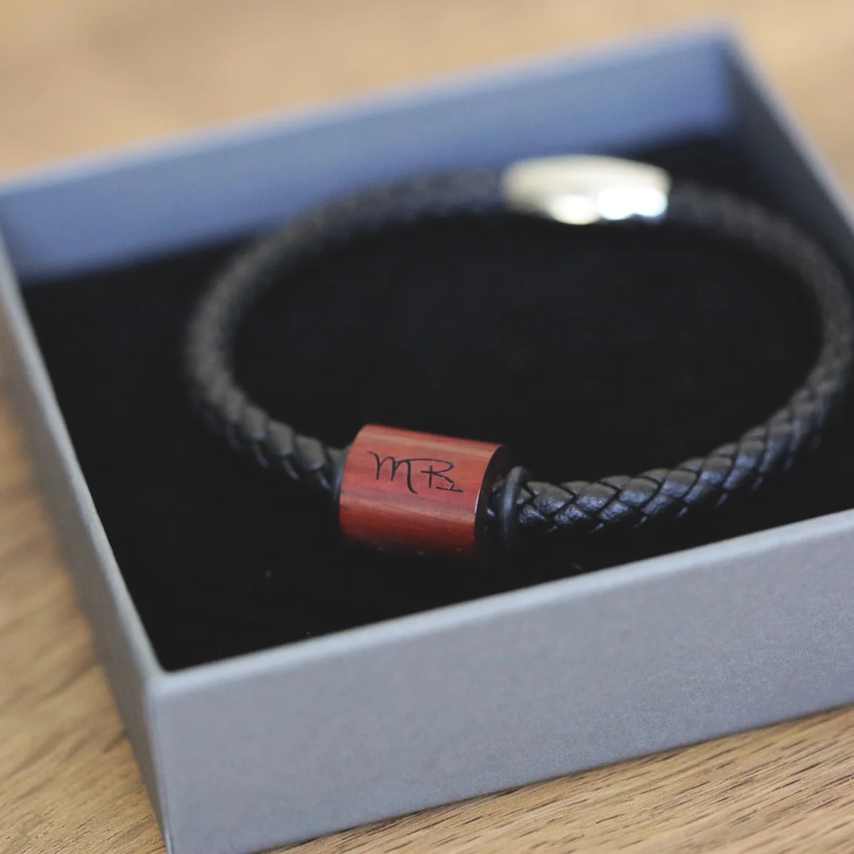 AC Milan sports microchip bracelet in black and red with interactive tap technology for real-time updates on a wrist model