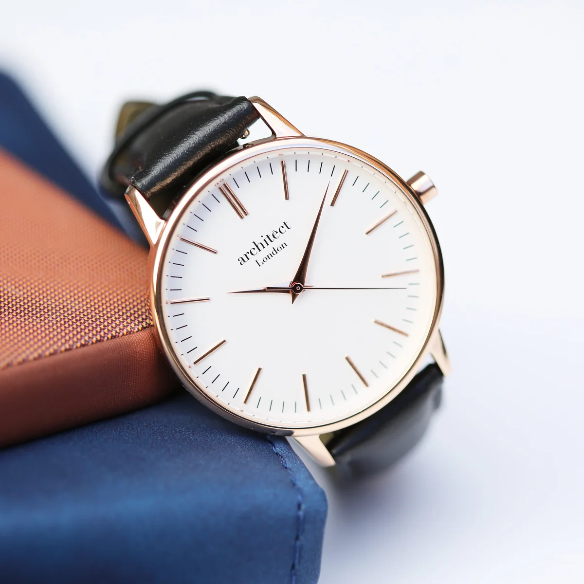 Ladies rose gold watch with black leather strap and minimalist dial, presented in luxury gift box