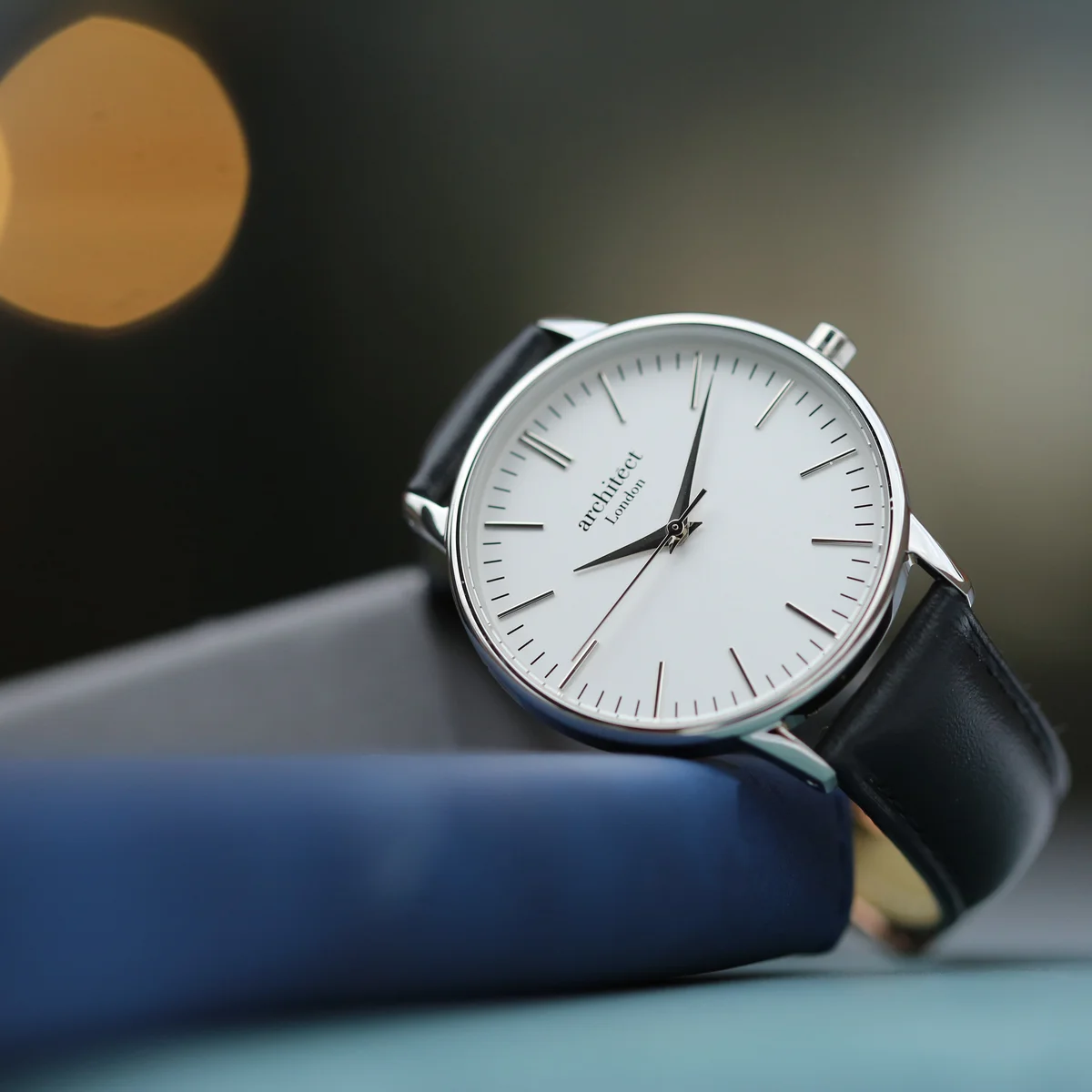 Ladies Architēct Blanc silver bezel quartz movement watch with black genuine leather strap on white background