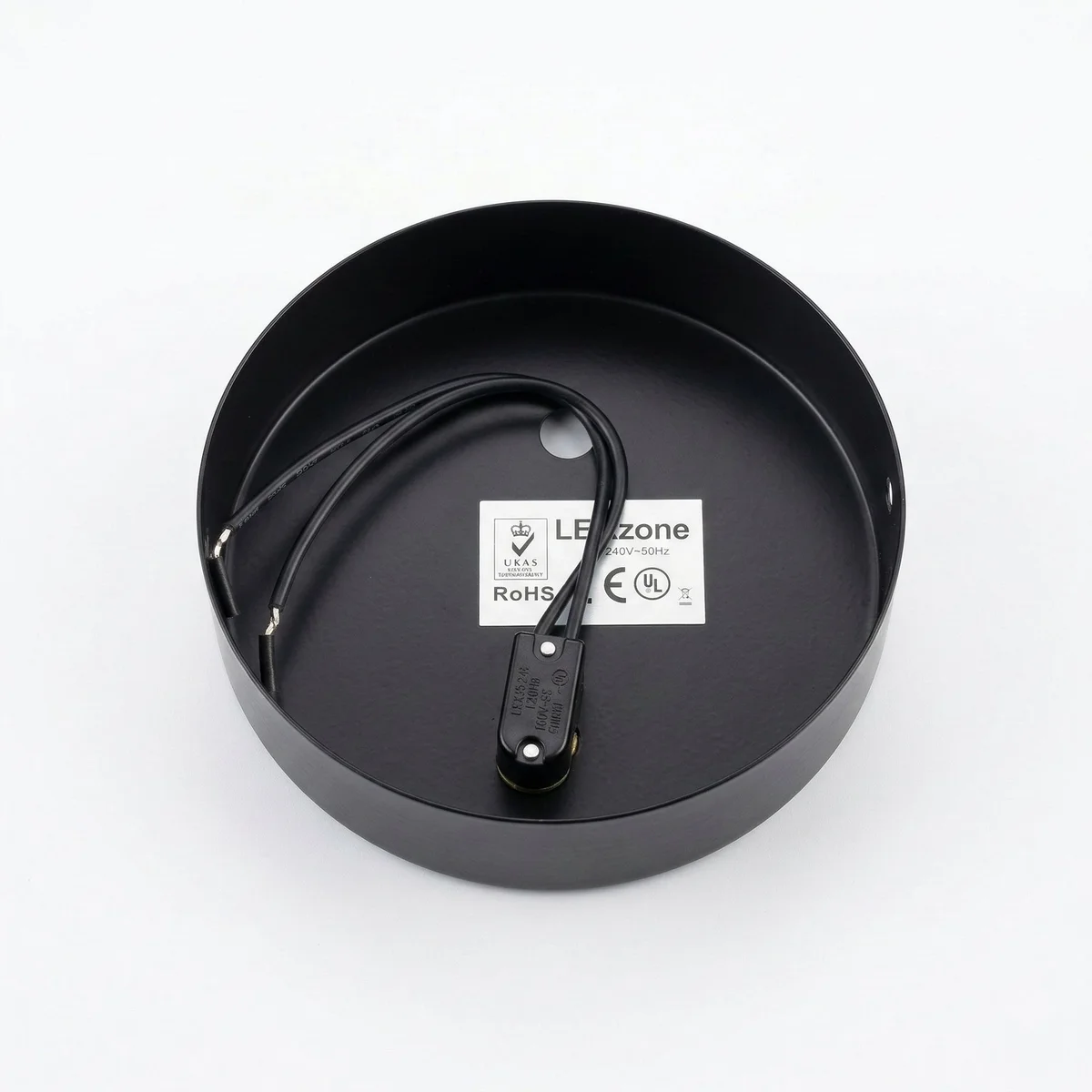 Black ceiling rose with brass toggle switch and pre-wired black cable for ceiling or wall mounting, 120mm diameter