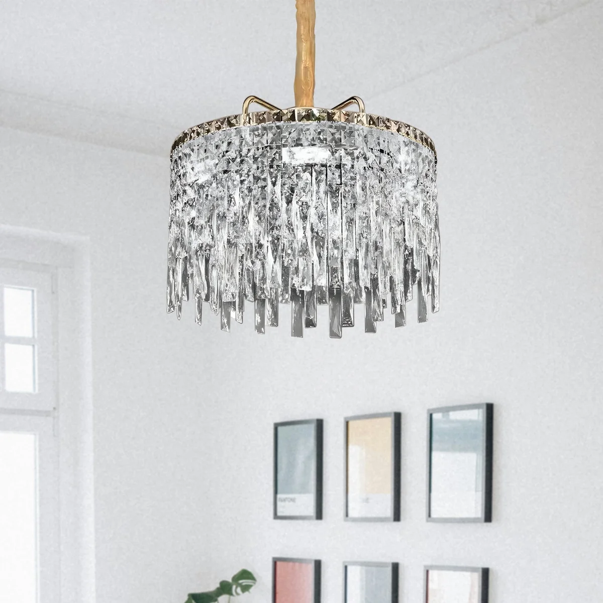 Modern gold ceiling mounted chandelier with clear crystal drops and round aluminium frame, suitable for indoor use