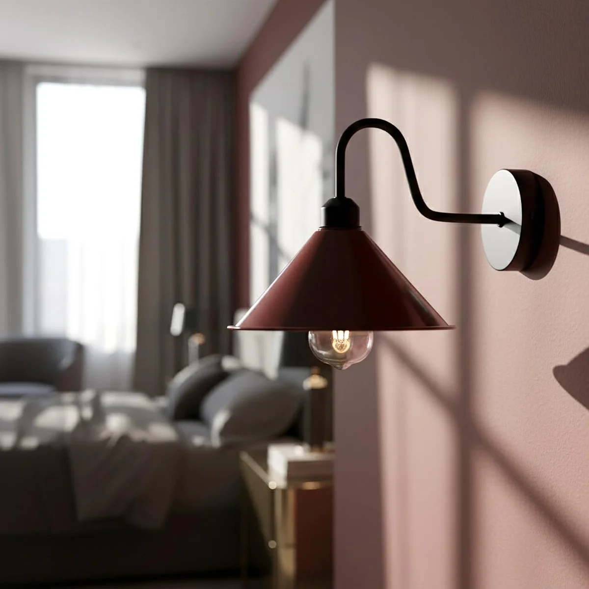Vintage wall lamp with burgundy metal cone shade and curved gooseneck arm, mounted on a white wall for reading light