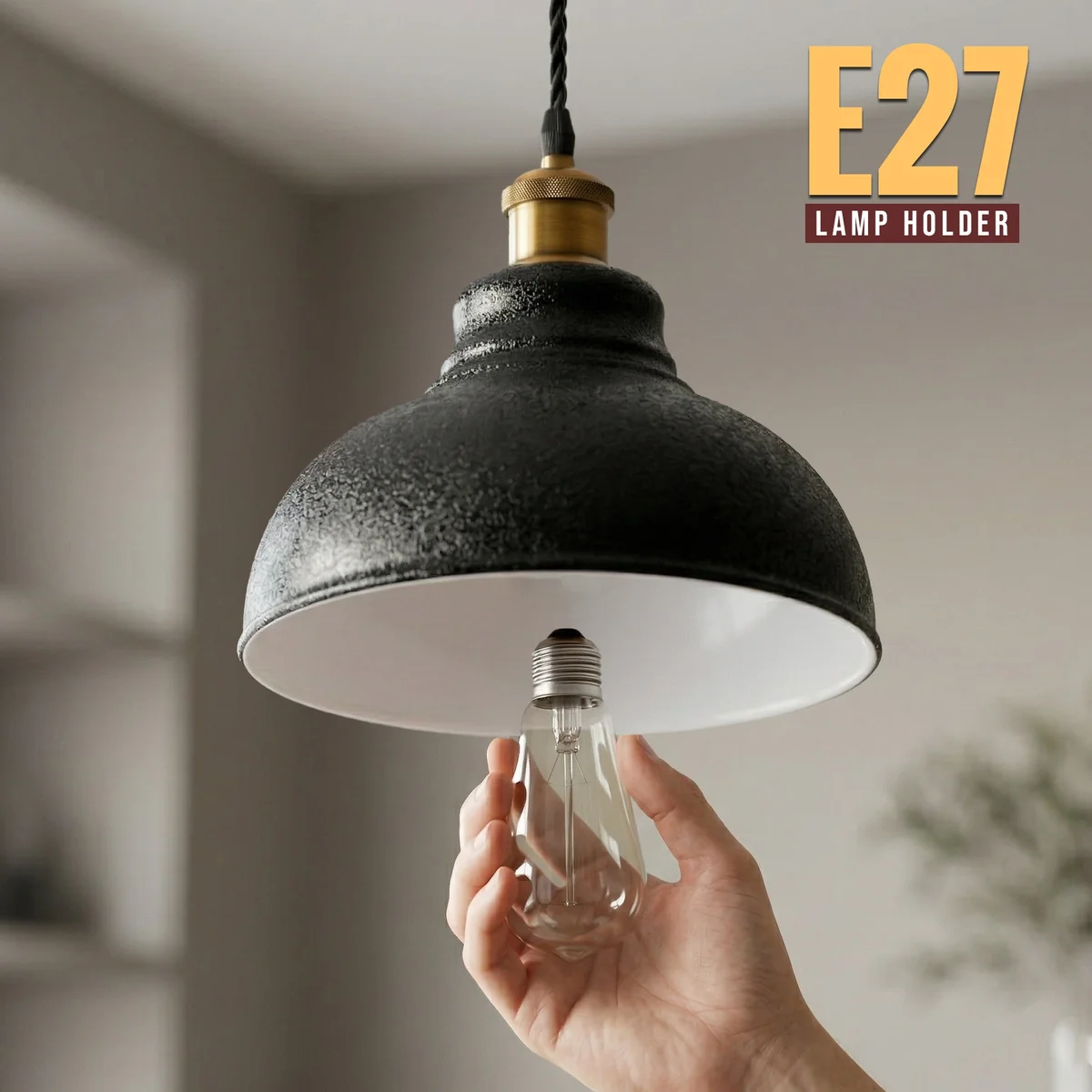 Black industrial pendant light with white inner shade and adjustable cable pendant hanging from ceiling hook