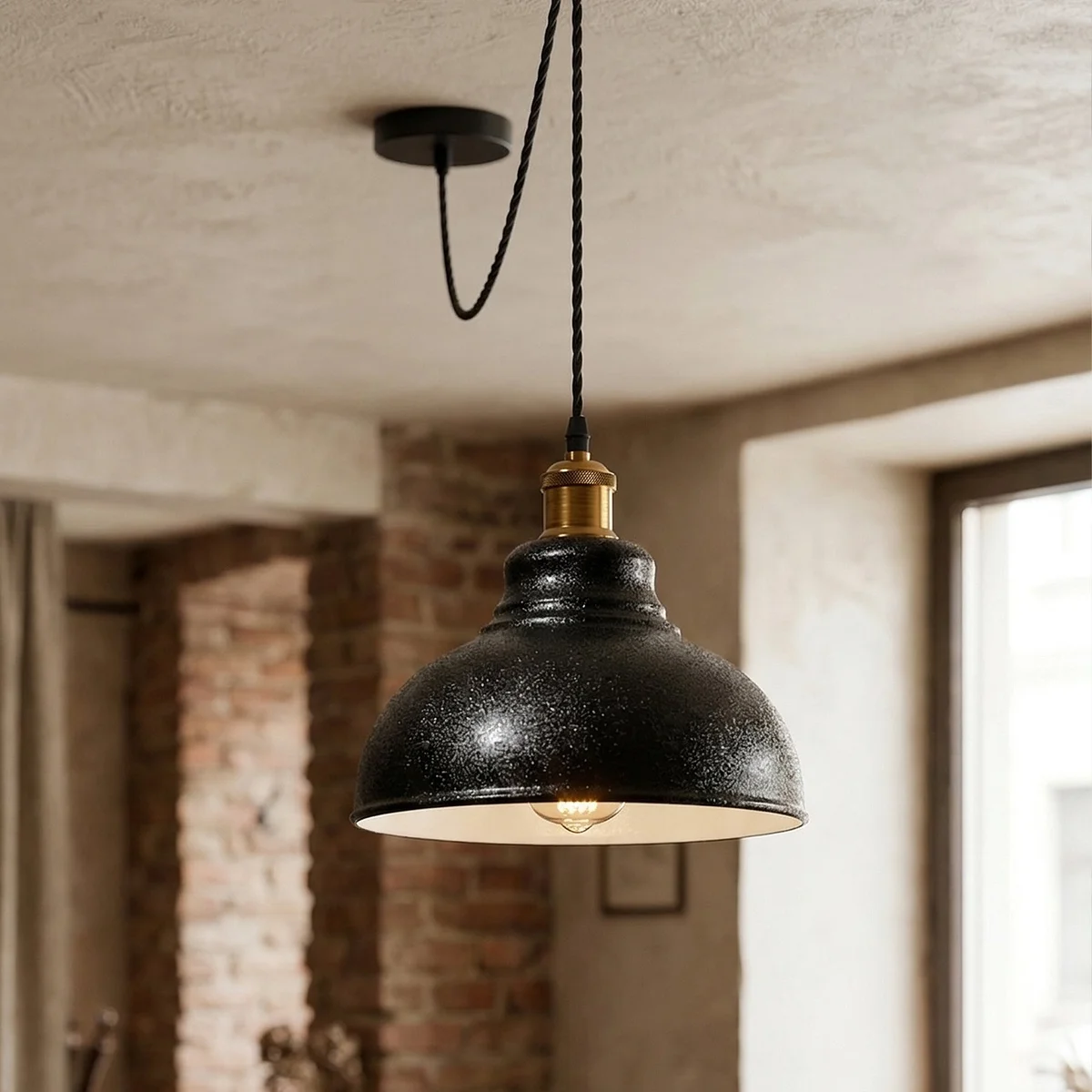 Black industrial pendant light with curvy metal shade, white interior, antique bronze holder, and adjustable 2m twisted cable