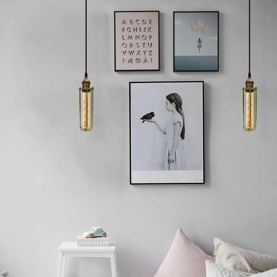 Single light adjustable cable pendant light with vintage industrial wire cage shade in black metal finish hanging from ceiling