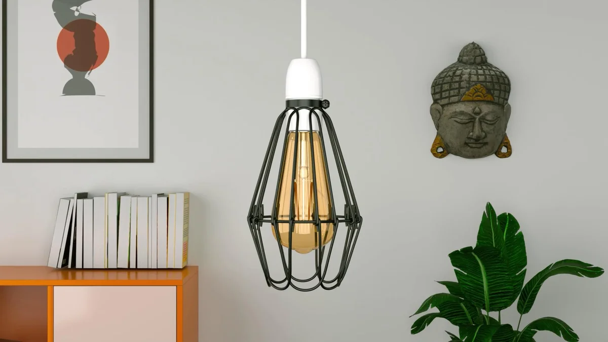 Black industrial wire cage pendant light shade with E27 socket and visible Edison bulb inside, hanging against white background