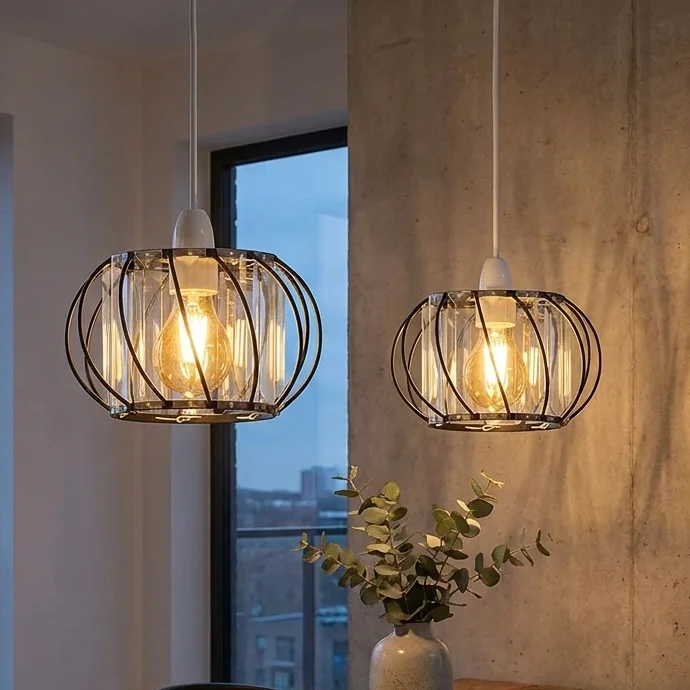 Two black crystal ceiling pendant lights with metal cage frames and clear crystal glass panels hanging from ceiling